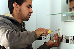 Ayoub, a former school dropout, completed the program and is now working as an electrician